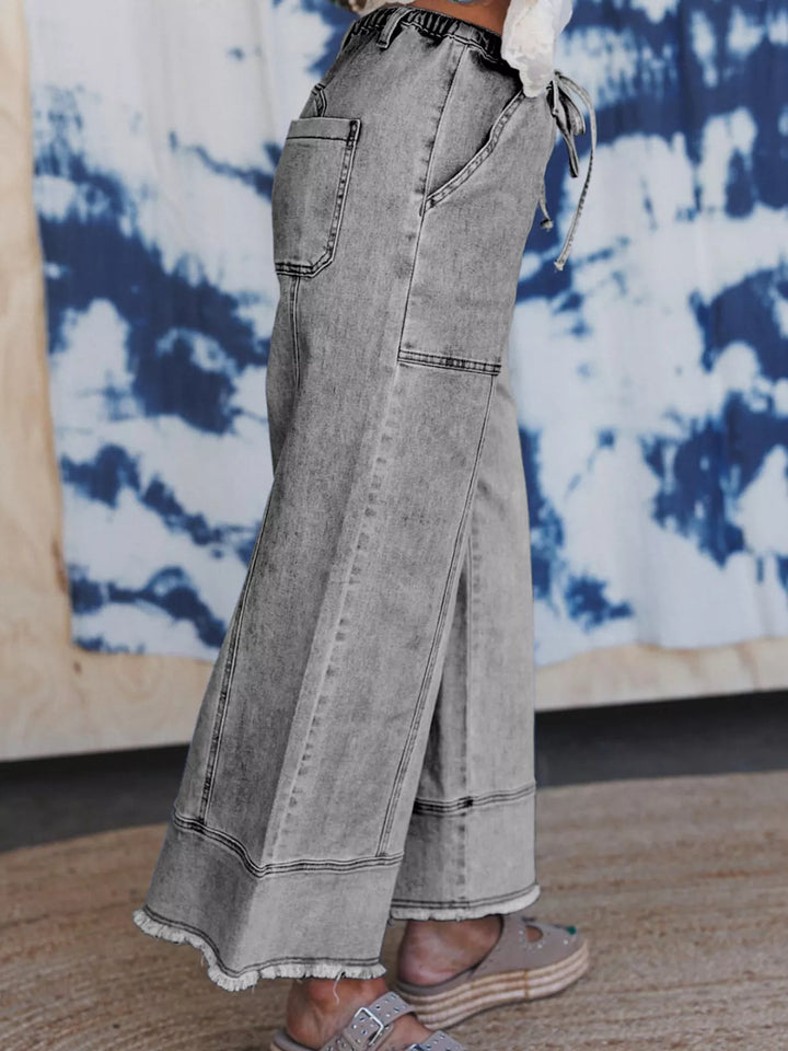 Wide-leg drawstring jeans with raw frayed hem