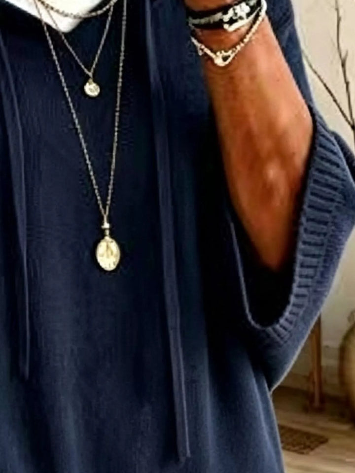 Oversized hooded sweater with drawstring and ribbed trim