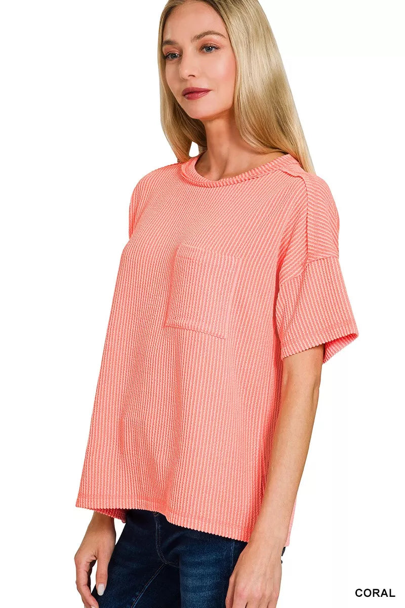 Raised rib short sleeve top with exposed seams and chest pocket
