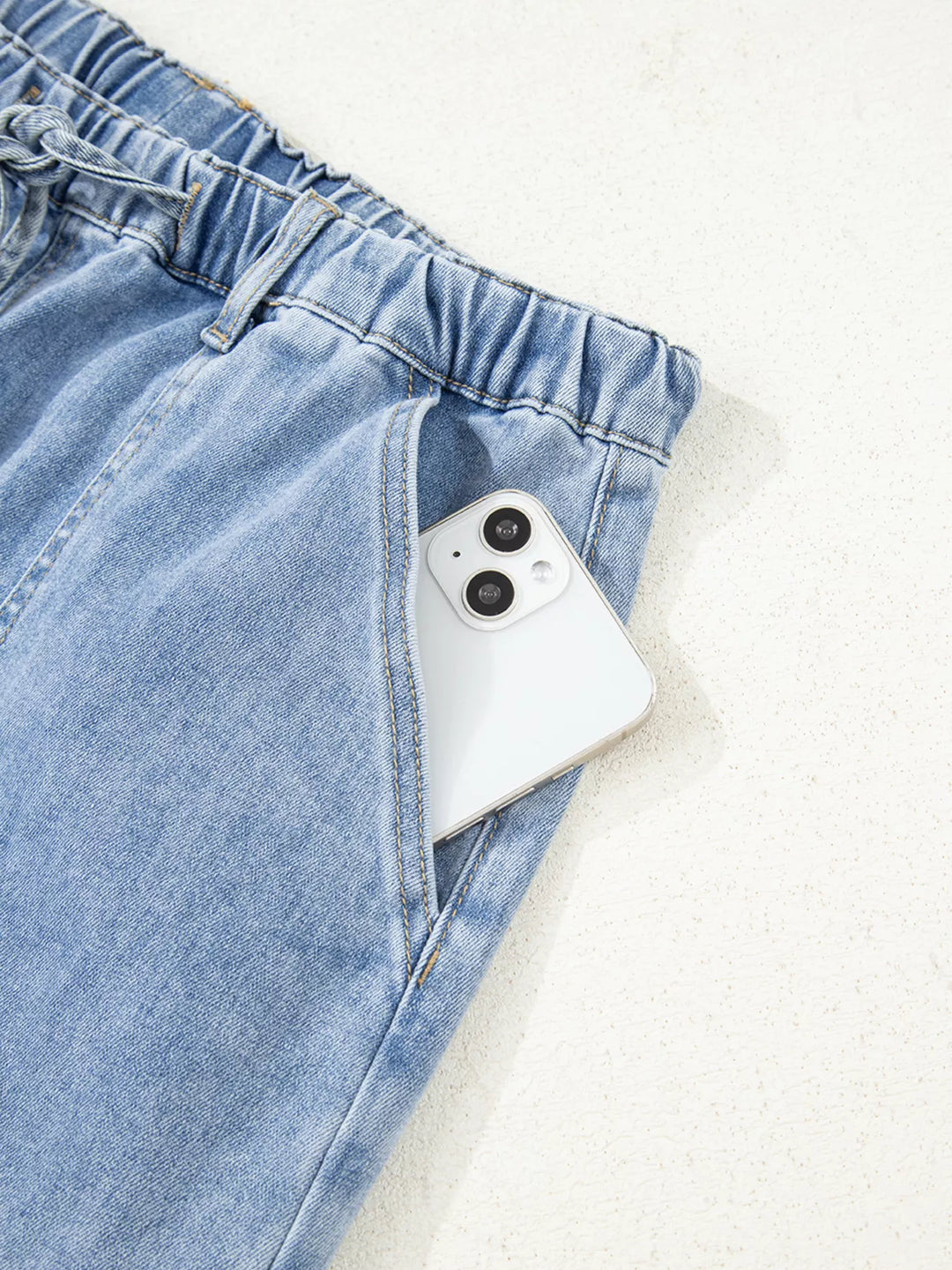 Wide-leg drawstring jeans with raw frayed hem