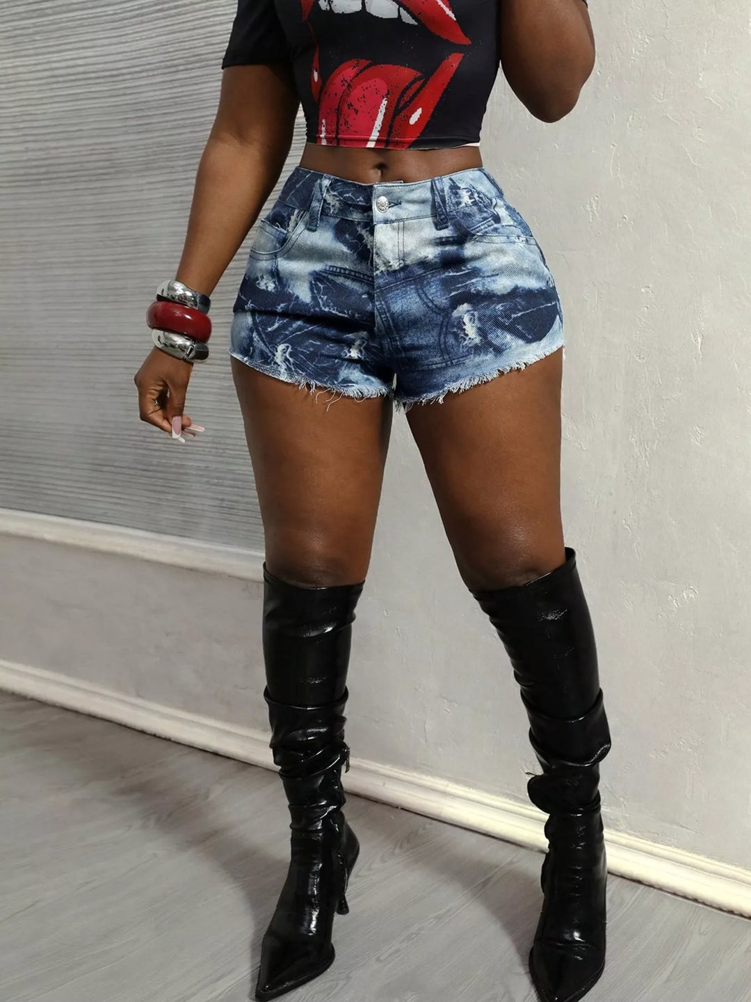 Distressed high-rise denim shorts with raw frayed hem