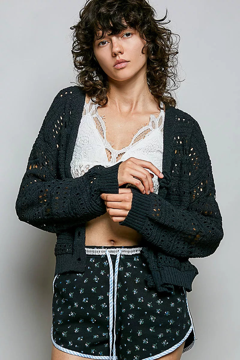 Open-knit cropped cardigan with 3D floral button closure