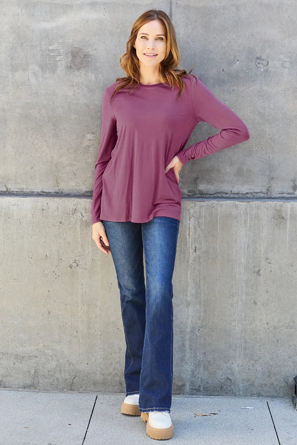Crew neck long sleeve top with curved hem