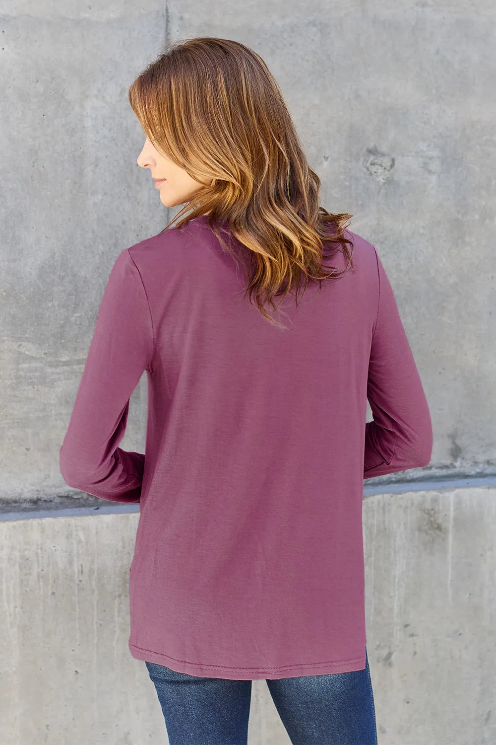 Crew neck long sleeve top with curved hem