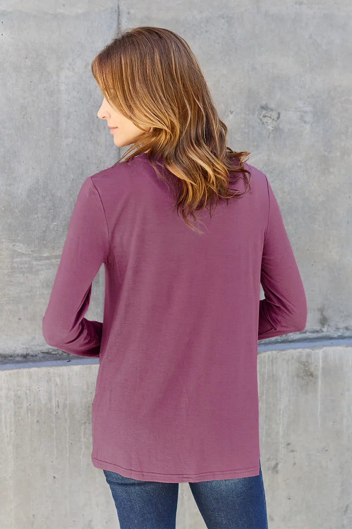 Crew neck long sleeve top with curved hem
