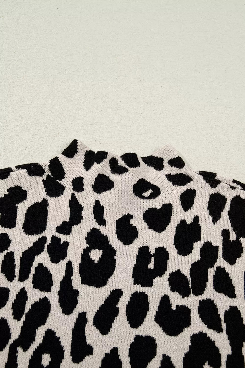 Leopard print mock neck cap sleeve sweater top
