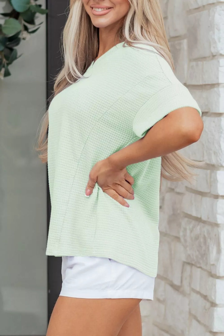 Plus size waffle knit V-neck top with cuffed short sleeves