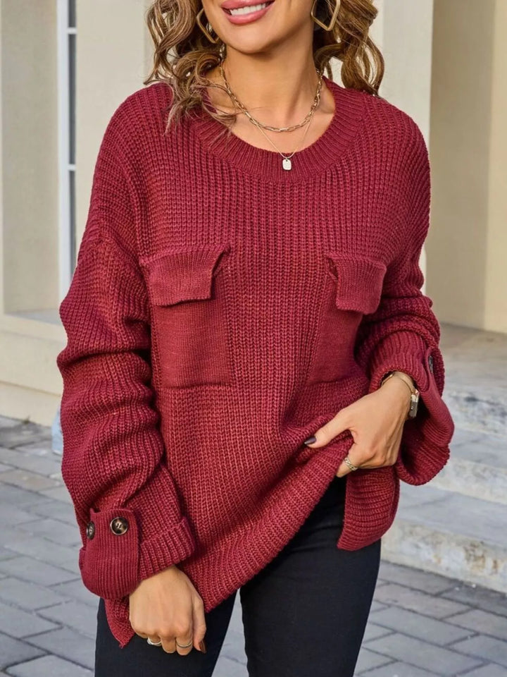 Ribbed knit sweater with chest pockets and button cuffs
