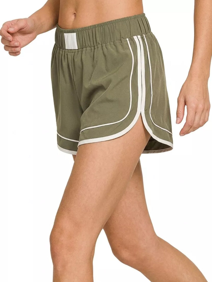 Woven dolphin-hem shorts with contrast piping and inner lining
