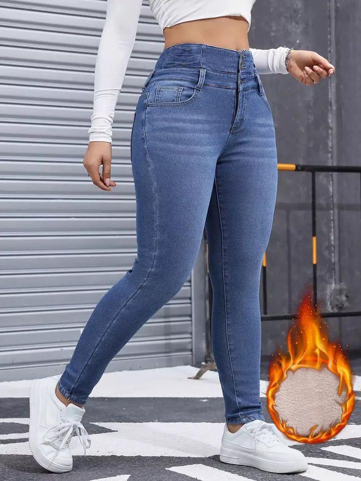 High-rise fleece-lined skinny jeans with stacked button waist