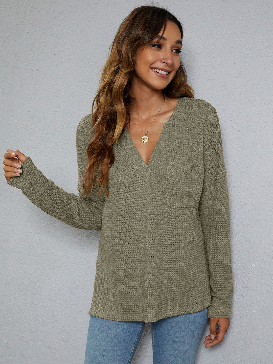 Dropped-shoulder waffle-knit V-neck top with high-low hem