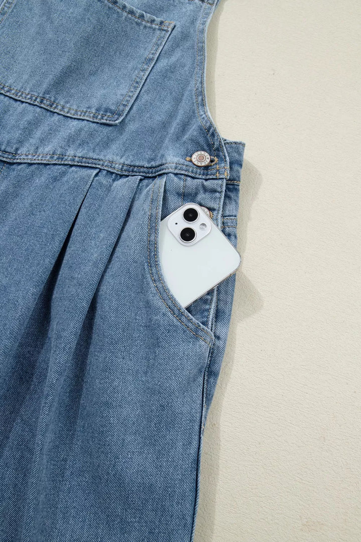 Pleated wide-leg denim overall jumpsuit with bib pocket
