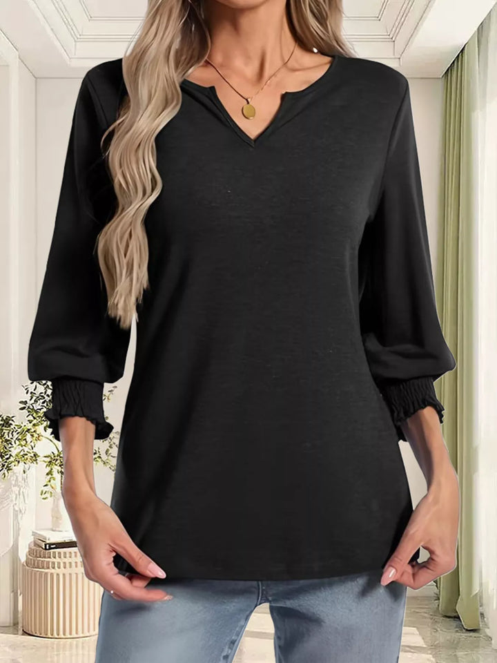 Notched V-neck three-quarter sleeve top with smocked cuffs