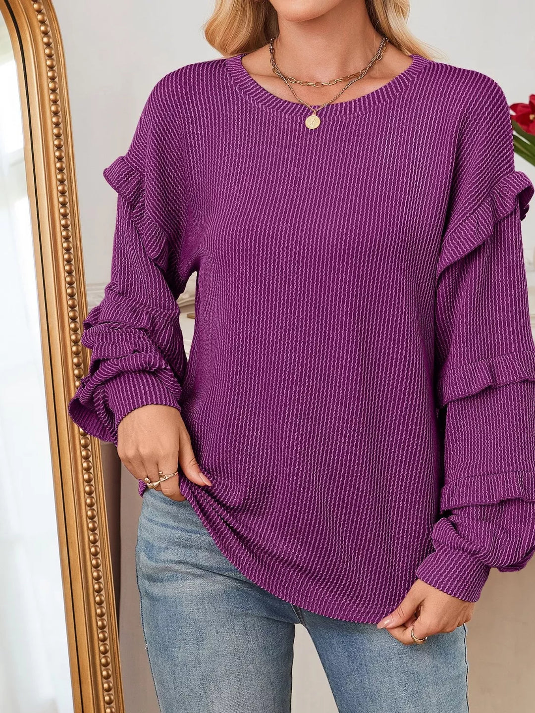 Ribbed knit top with ruffle-tiered long sleeves