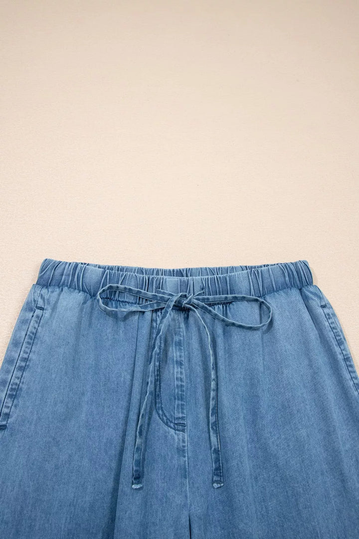 Wide-leg chambray pants with drawstring waist and ruffle hem