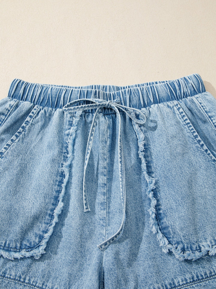 Drawstring denim shorts with raw hem and patch pockets