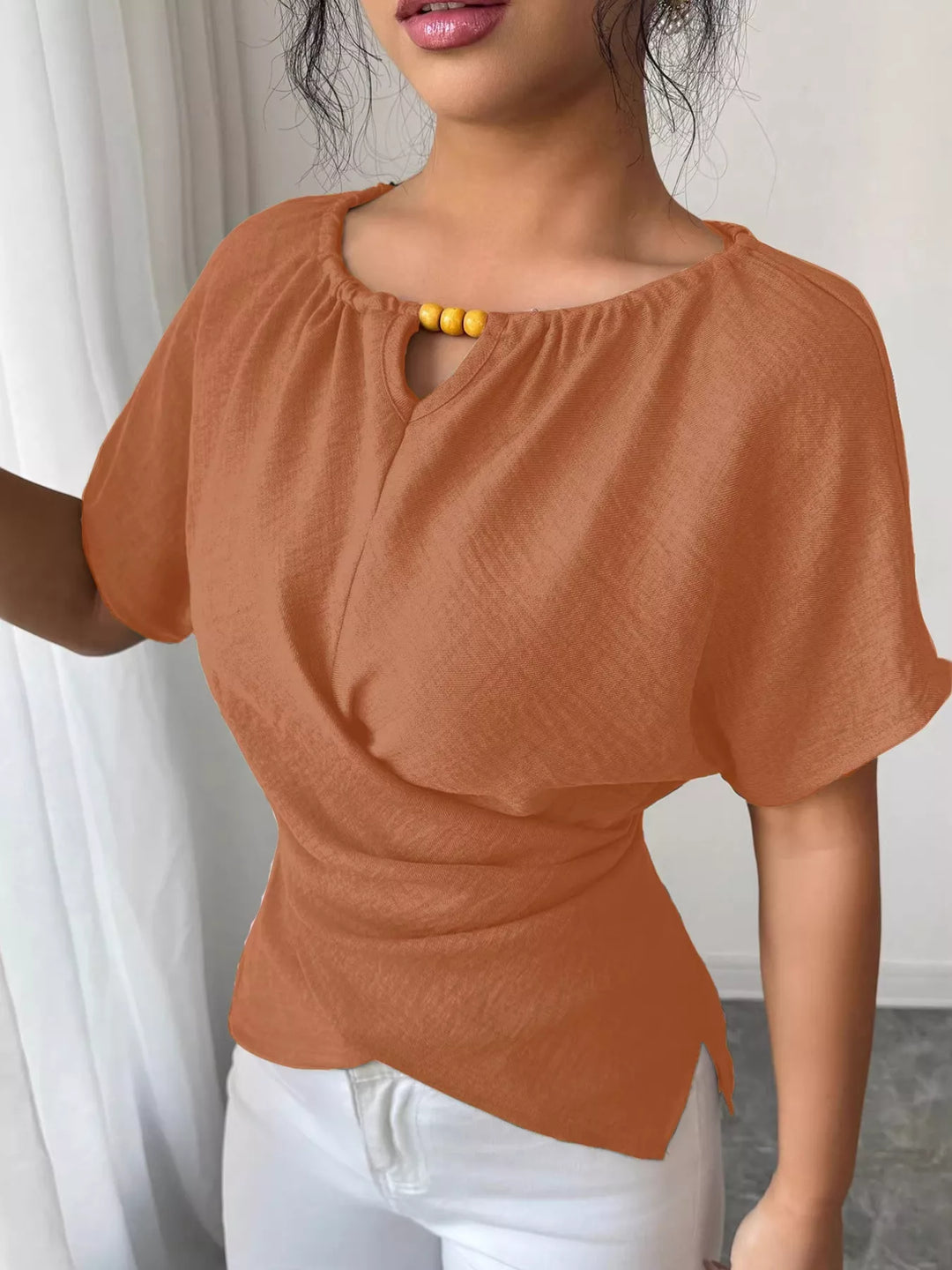 Wrap-front short sleeve blouse with beaded keyhole neckline