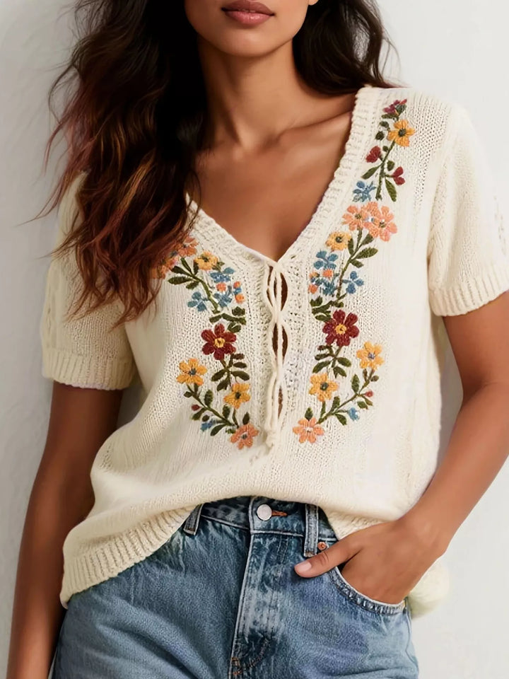 Beige Floral embroidered short sleeve knit sweater with lace-up neckline