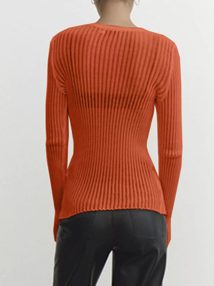 Sheer ribbed knit long sleeve top with flared cuffs