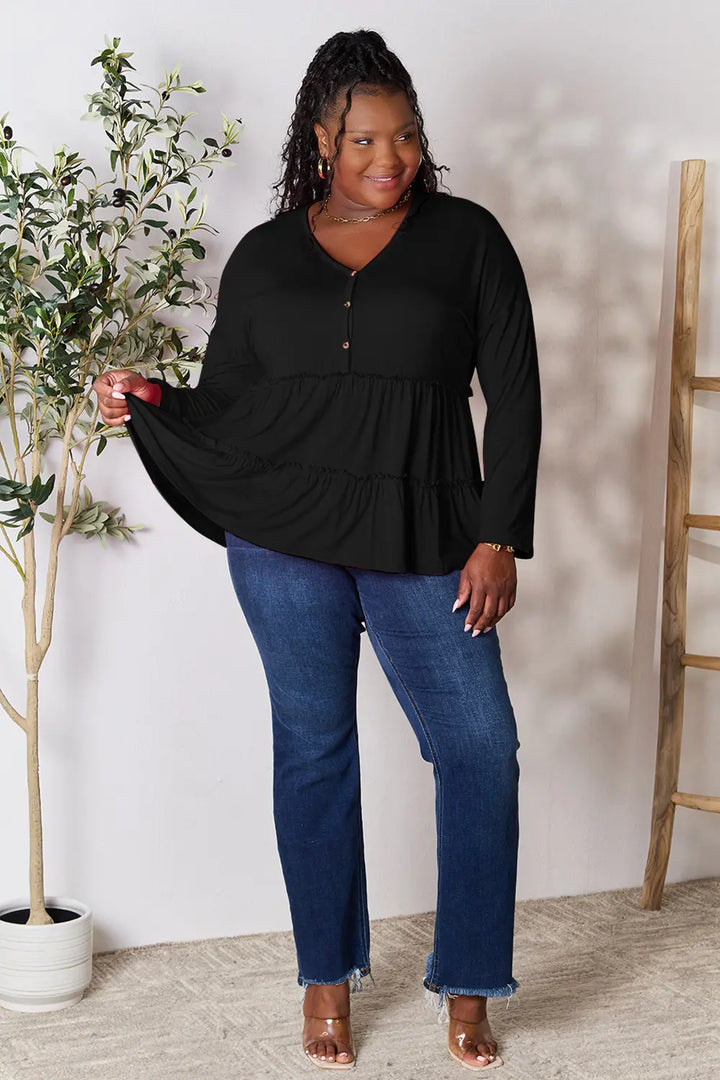 Half-button long sleeve blouse with tiered ruffle hem