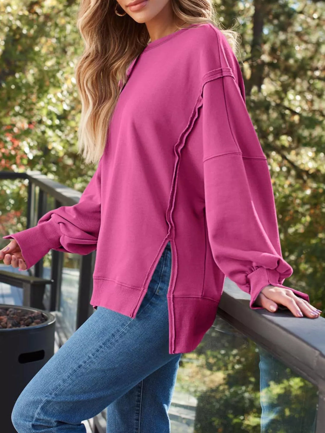 Oversized side-slit sweatshirt with exposed seams