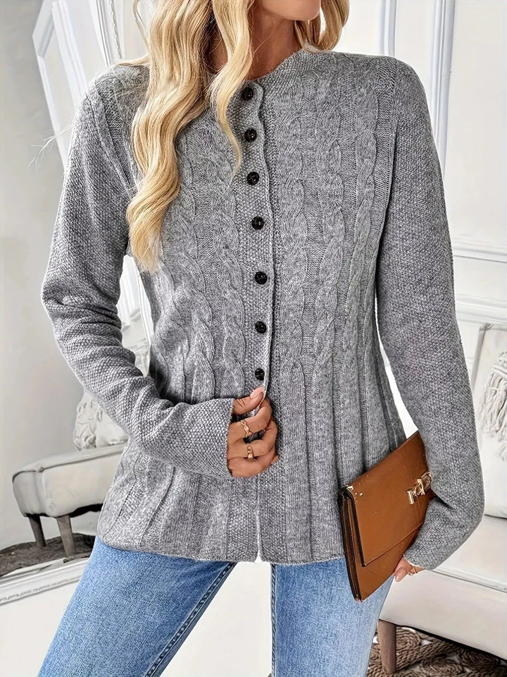 Cable knit button-up cardigan with peplum hem