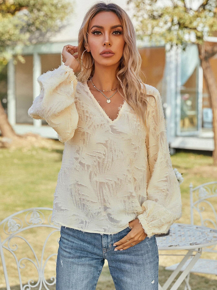 Cream Textured v-neck blouse with balloon sleeves