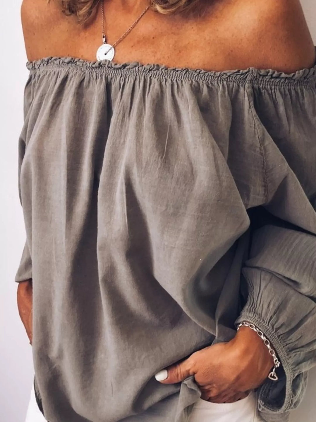 Off-shoulder ruffle-neck blouse with long puff sleeves