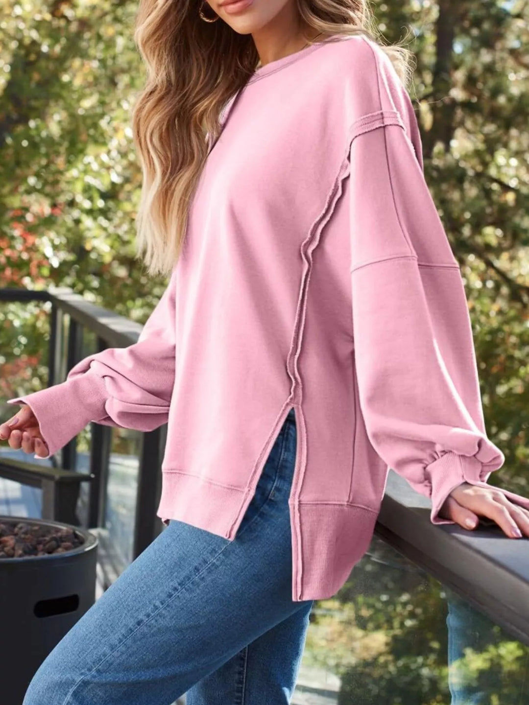 Oversized side-slit sweatshirt with exposed seams