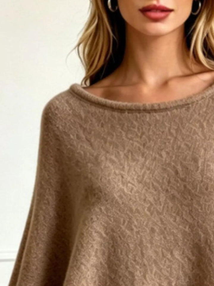 Asymmetrical hem textured knit poncho with ribbed crew neck