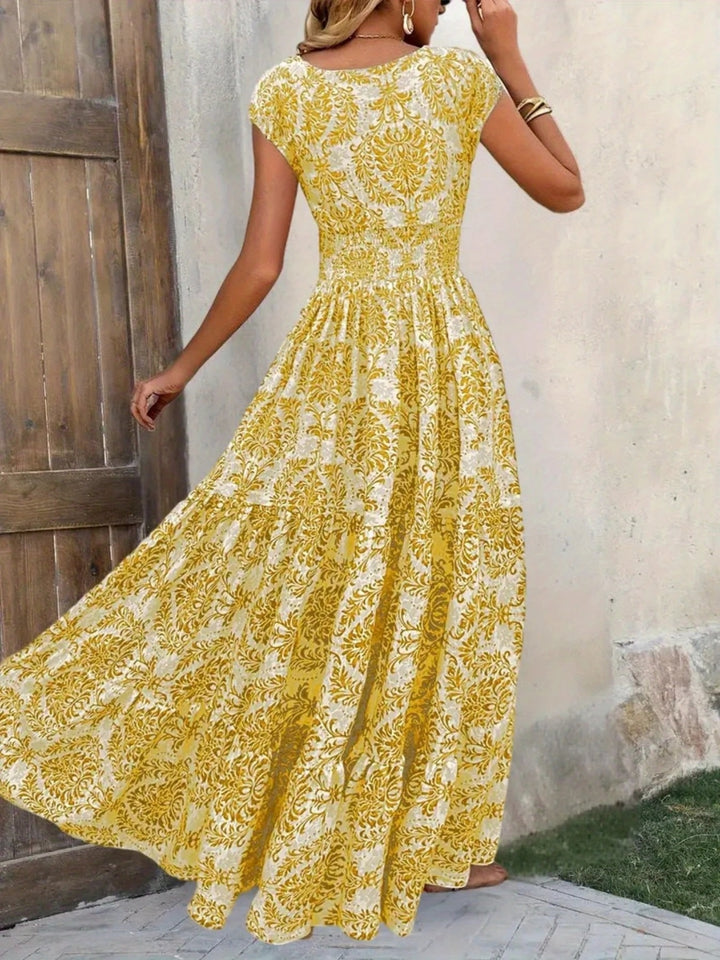 Smocked tiered maxi dress with cap sleeves and side slit