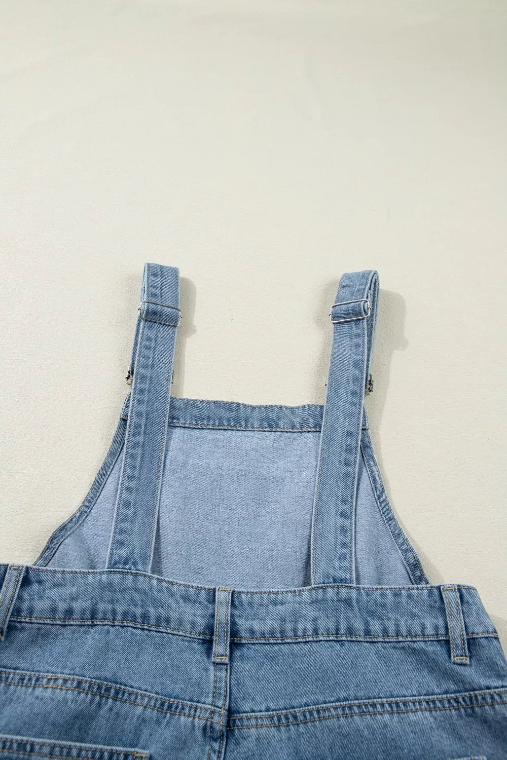 Pleated wide-leg denim overall jumpsuit with bib pocket