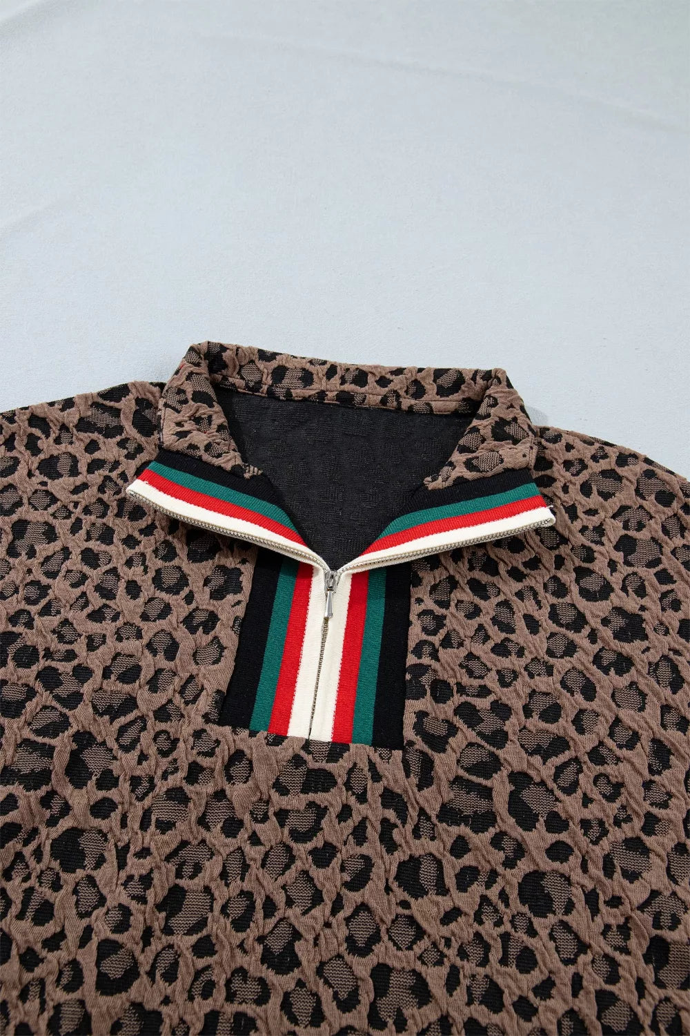 Leopard half-zip short sleeve top with striped collar and cuffs
