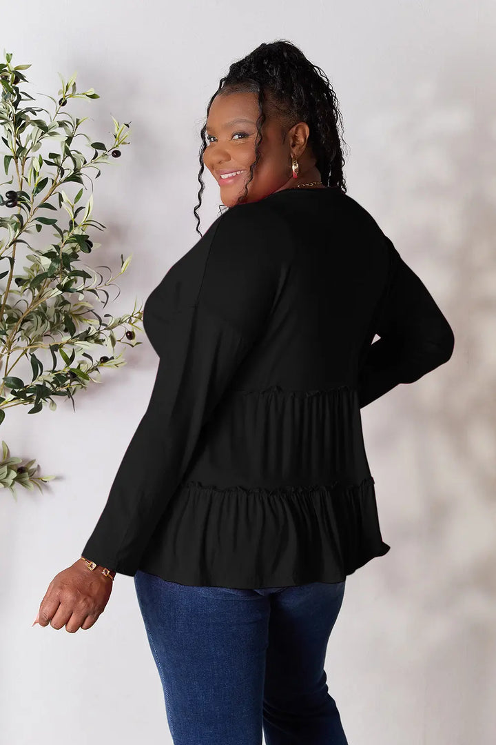 Half-button long sleeve blouse with tiered ruffle hem