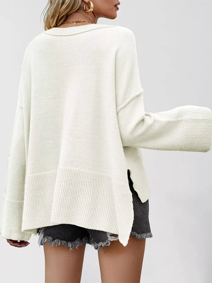 Dropped shoulder flare sleeve sweater with ribbed hem and side slits