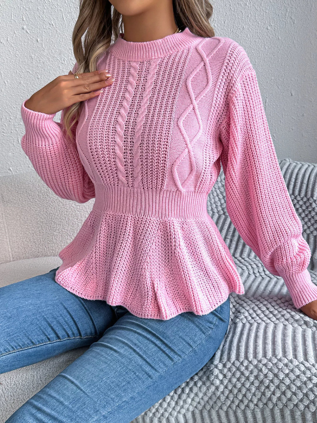 Cable knit peplum sweater with mock neck