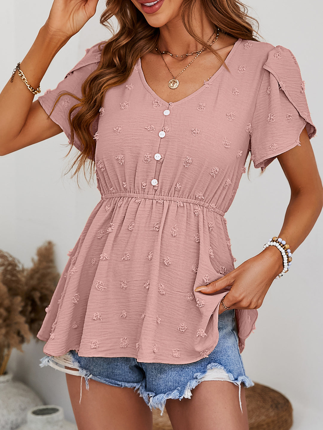 Swiss dot peplum blouse with flutter sleeves and button front