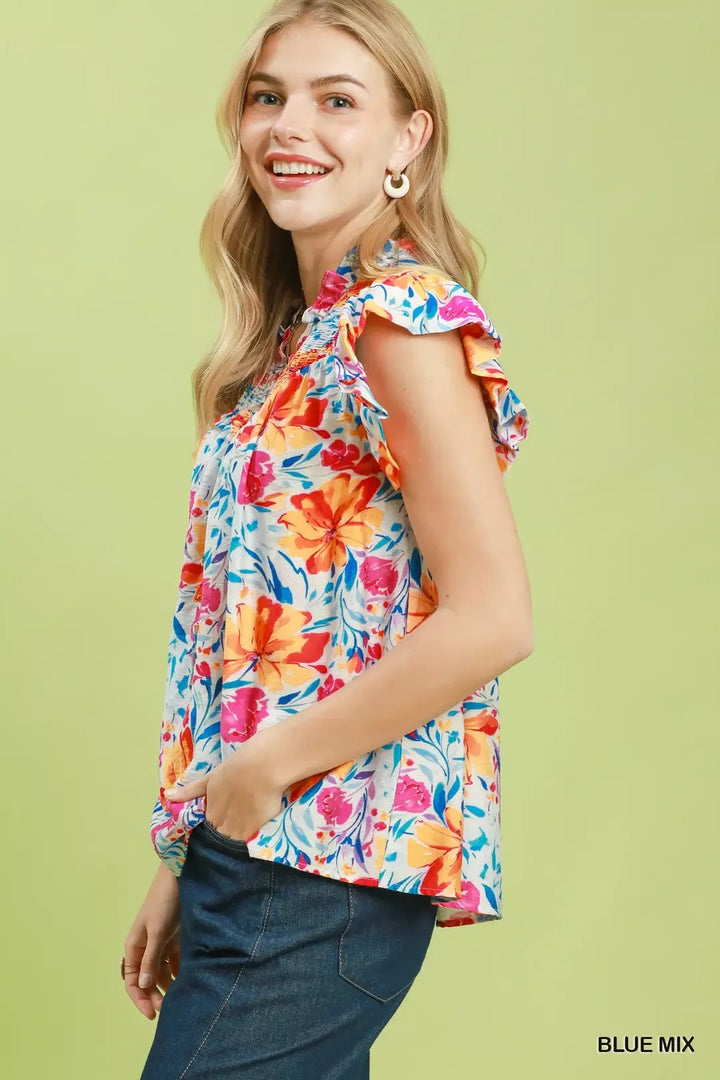 Smocked yoke floral blouse with flutter ruffle sleeves