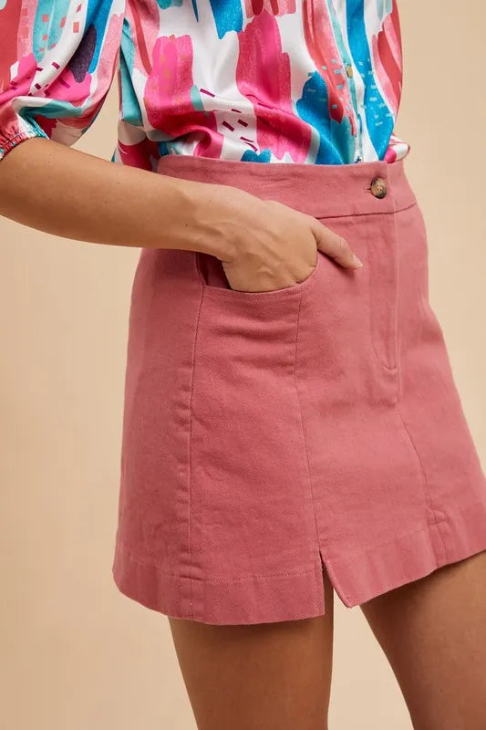 Stretch cotton mini skirt with side slits and front pockets