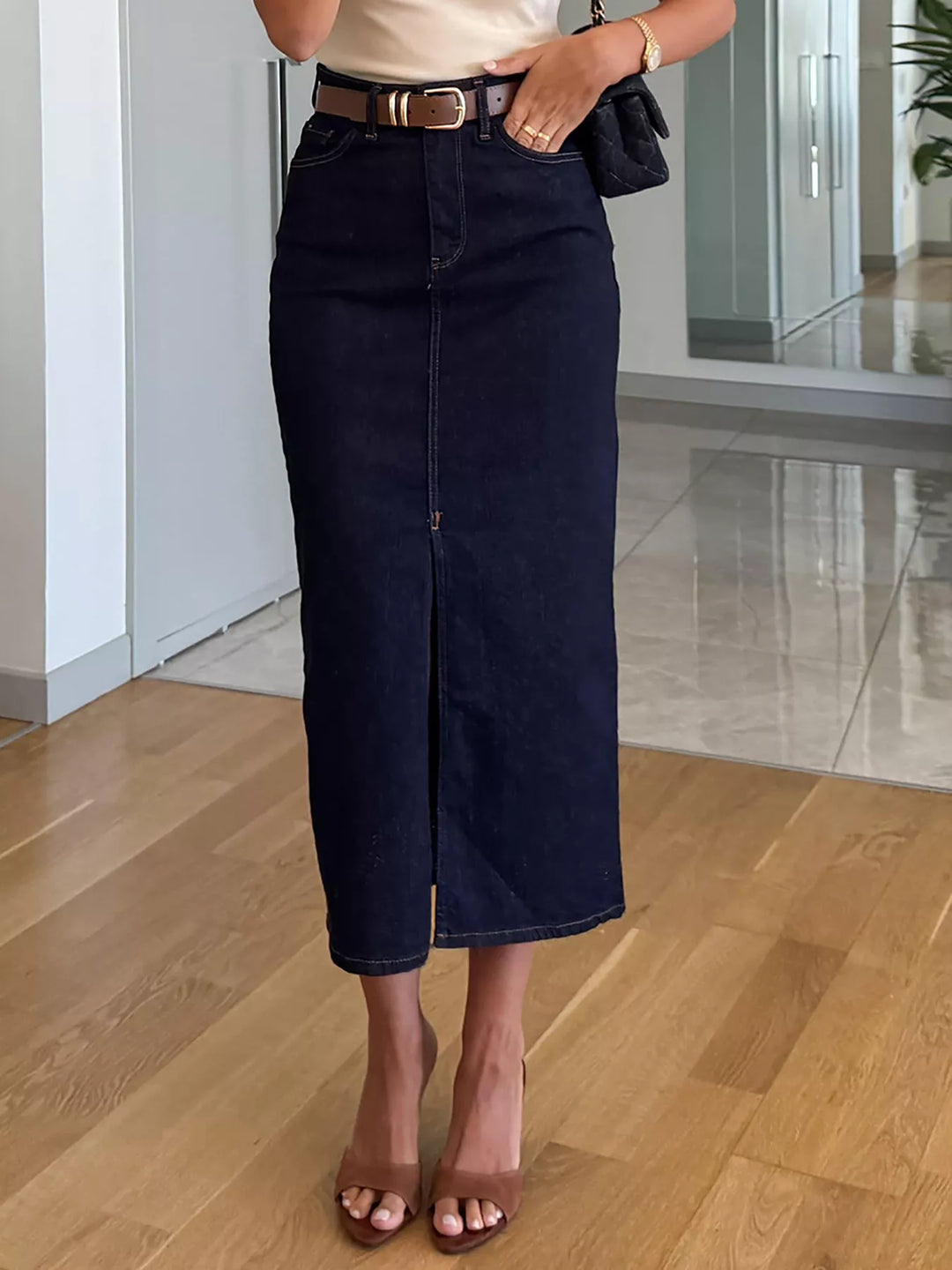 High-rise denim midi skirt with center front slit