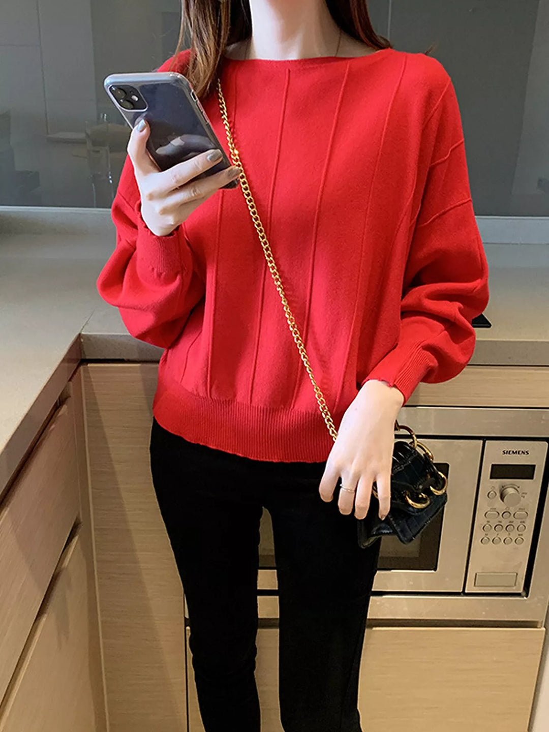Boat neck batwing sleeve knit pullover with ribbed hem