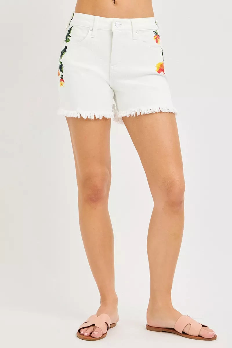 High-rise embroidered floral denim shorts with raw hem