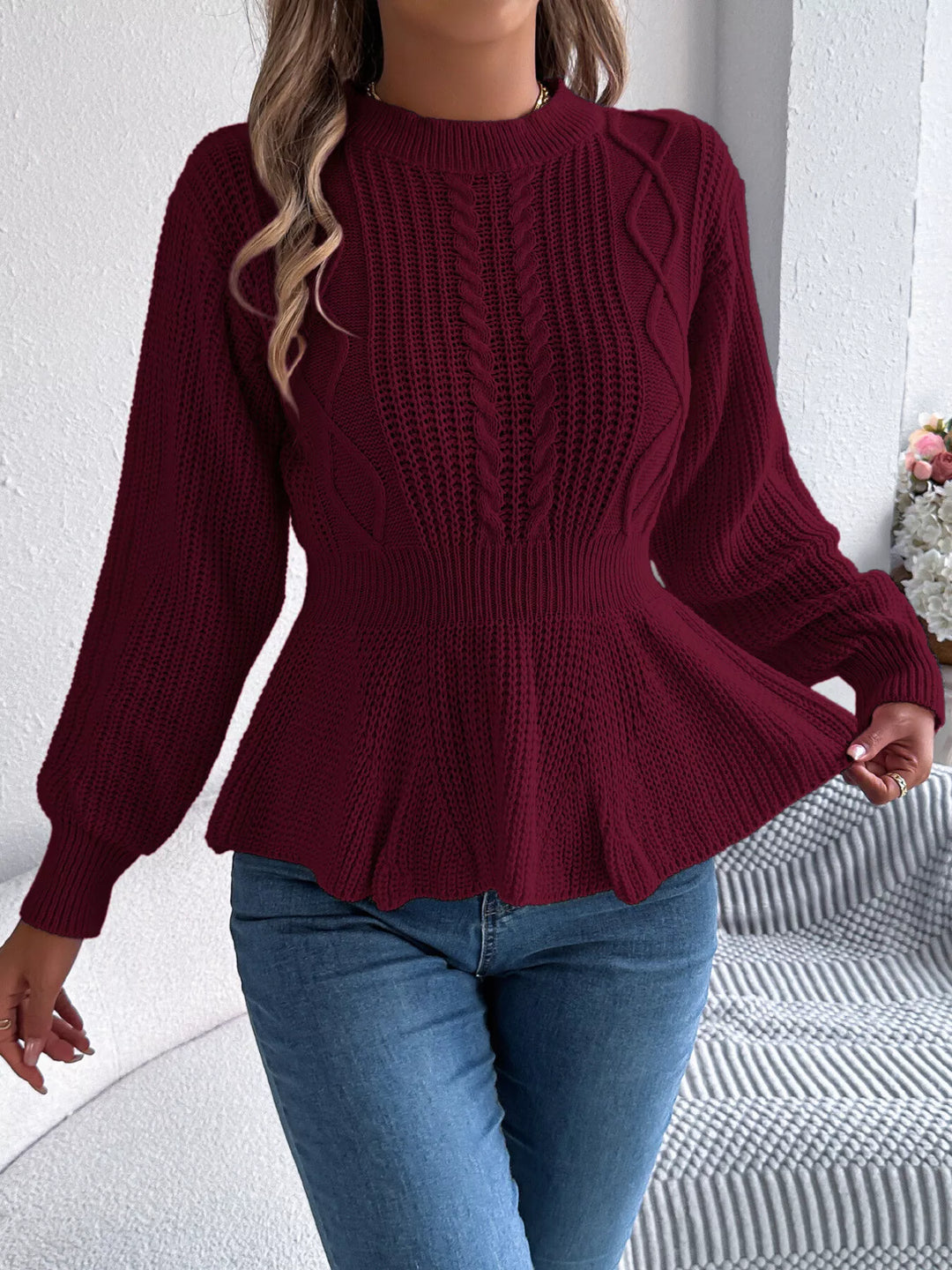 Cable knit peplum sweater with mock neck