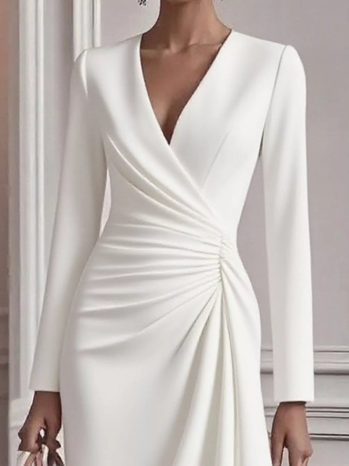 Ruched surplice long sleeve midi dress with asymmetric hem