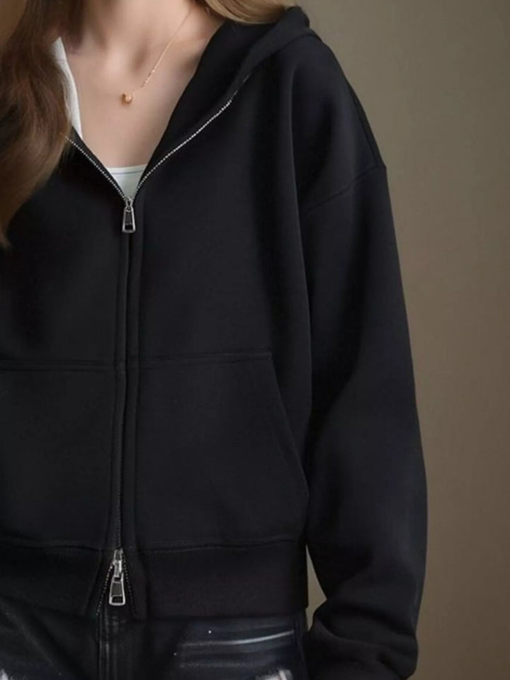 Zip-up hoodie with front pockets and ribbed cuffs