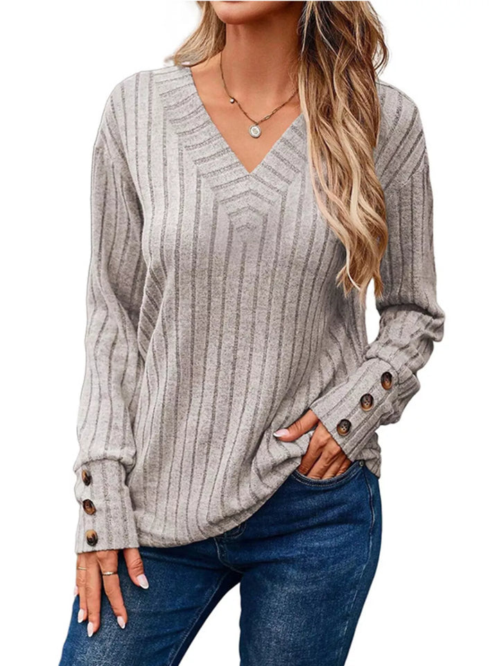 Ribbed knit V-neck top with buttoned cuffs
