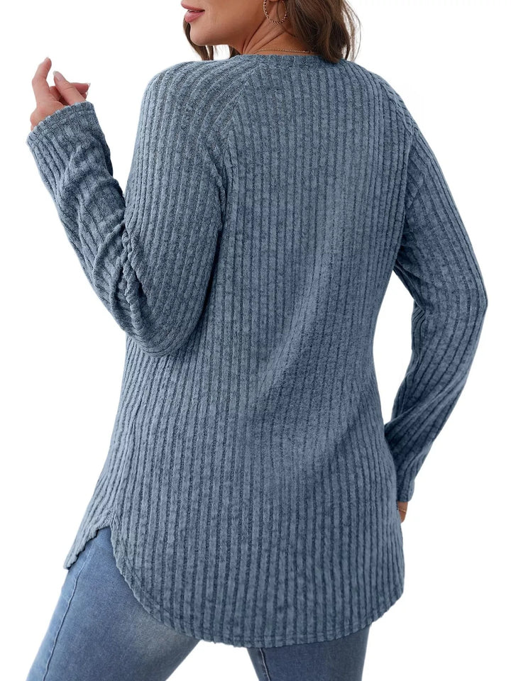 Ribbed knit crew neck long sleeve top with curved hem