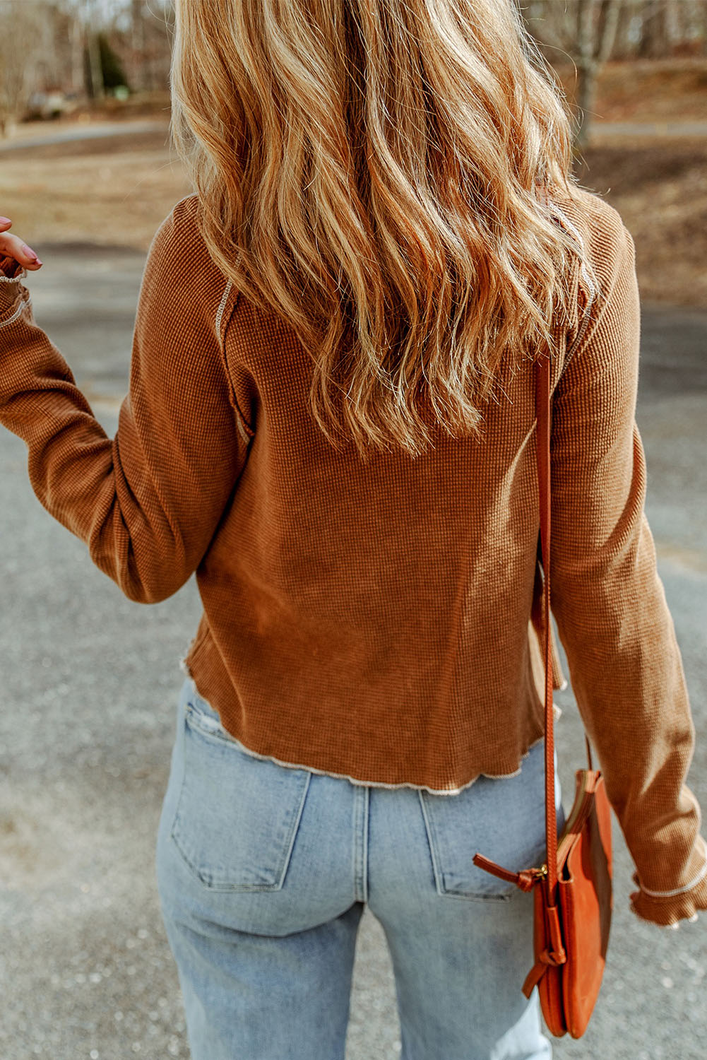 Waffle knit raglan sleeve top with ruffle cuffs