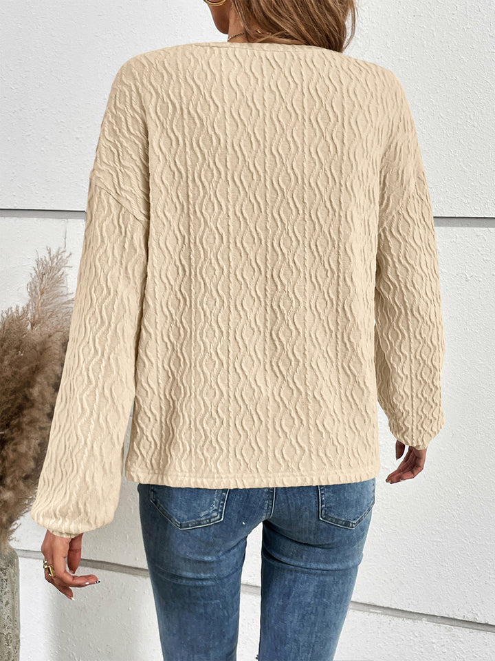 Textured half-button henley top with long sleeves