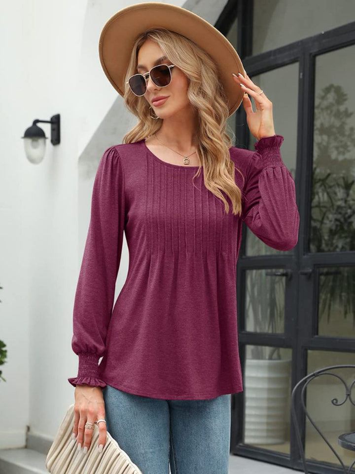 Pleated front lantern sleeve blouse with smocked cuffs